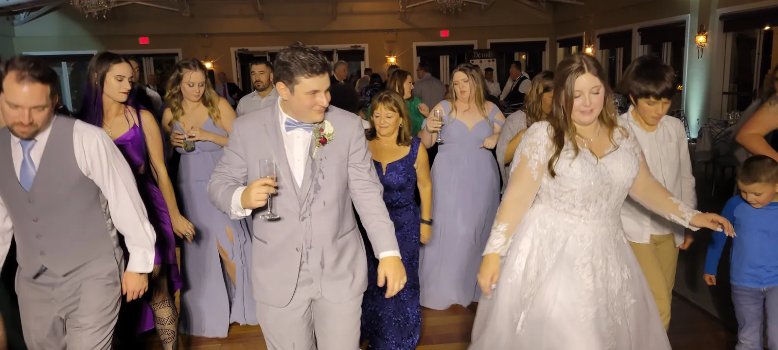 Bride and groom dancing with guests at Granite Bay Golf Club, Granite Bay CA, with J Crew Productions
