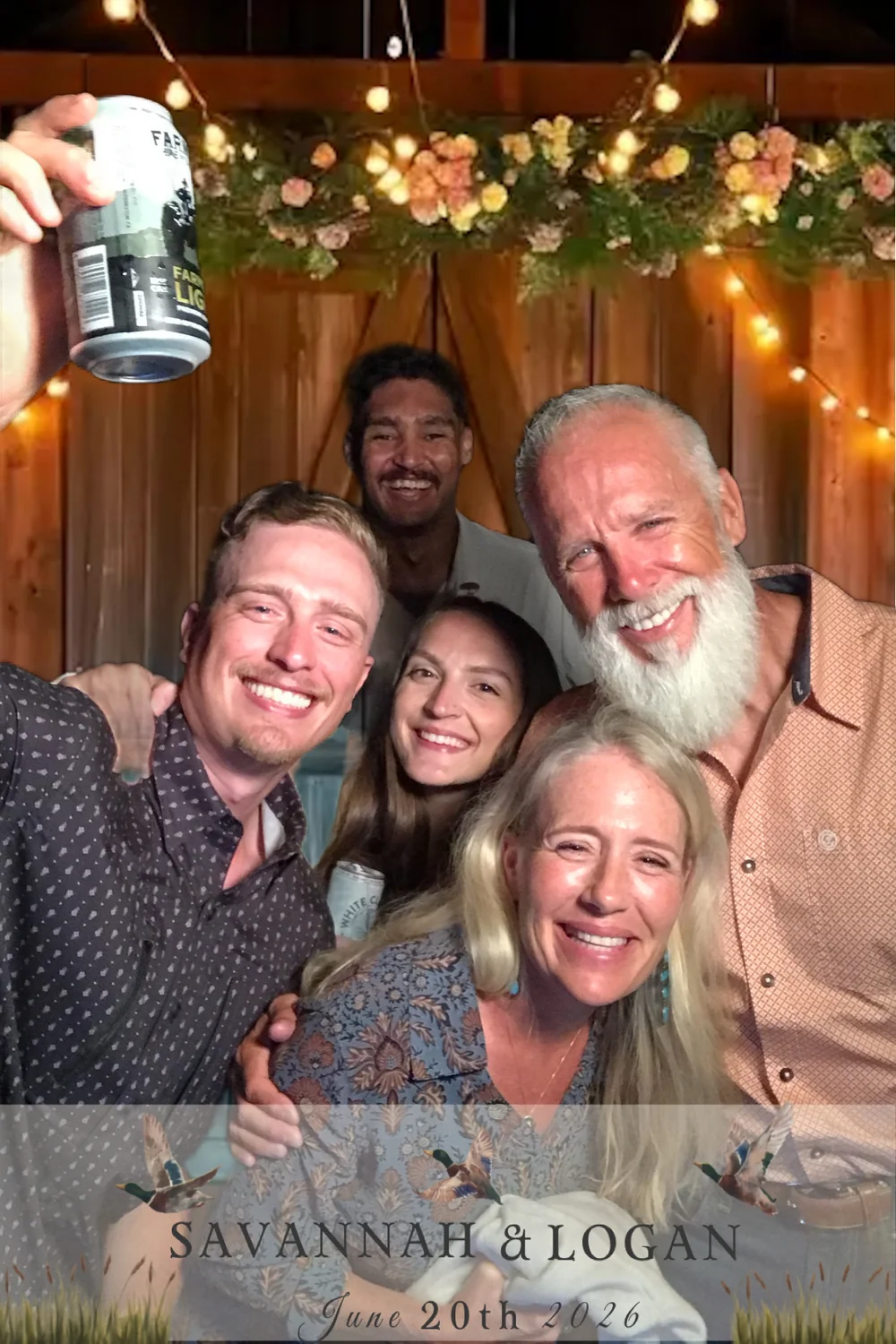 Wedding guests taking a group selfie at the J Crew digital LED photo booth
