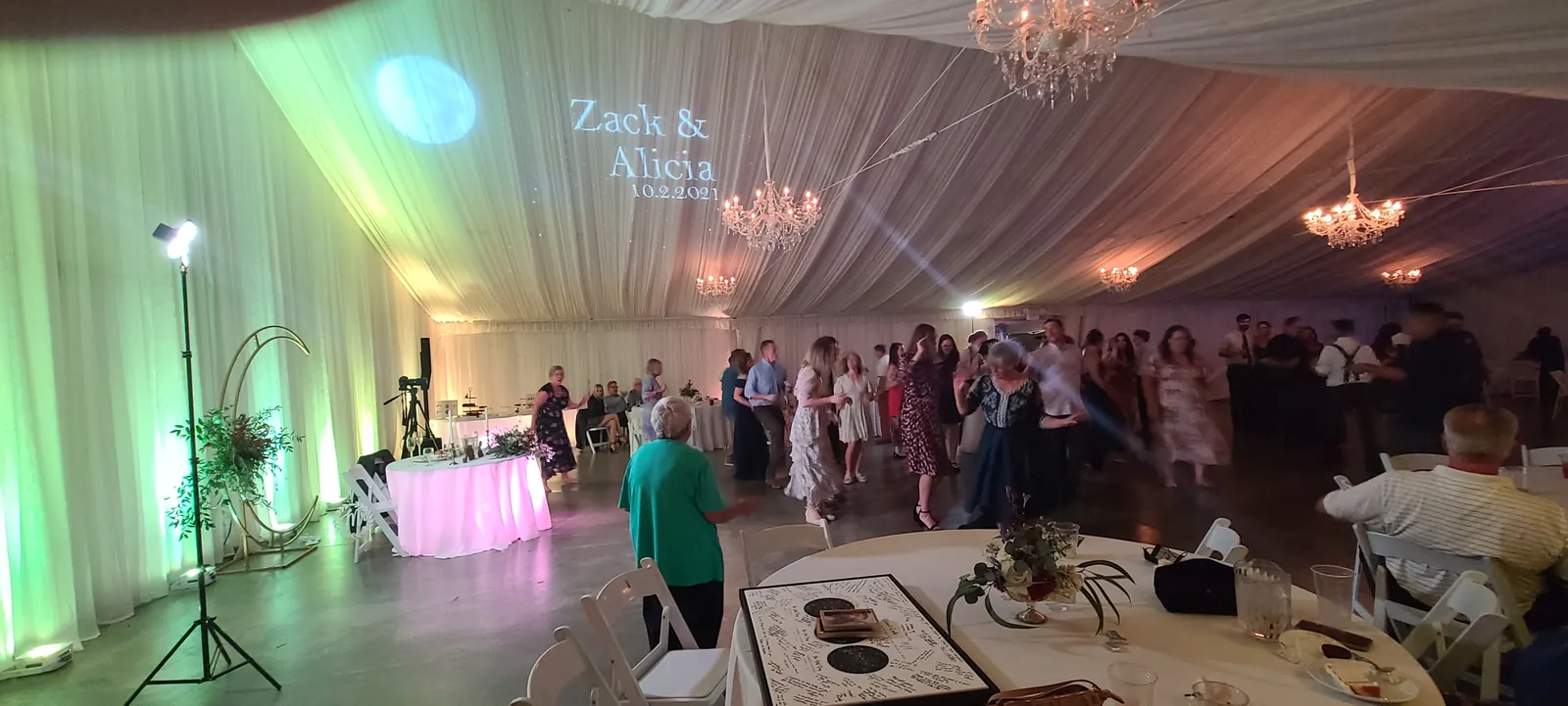 Uplit tented wedding reception with draped ceiling at Haggin Oaks, Sacramento